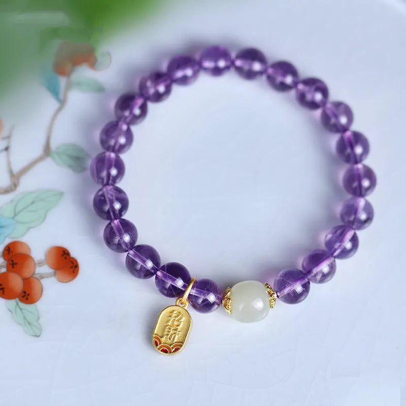 Amethyst colour crystal bead bracelet with 8mm round beads in a geometric national style design.