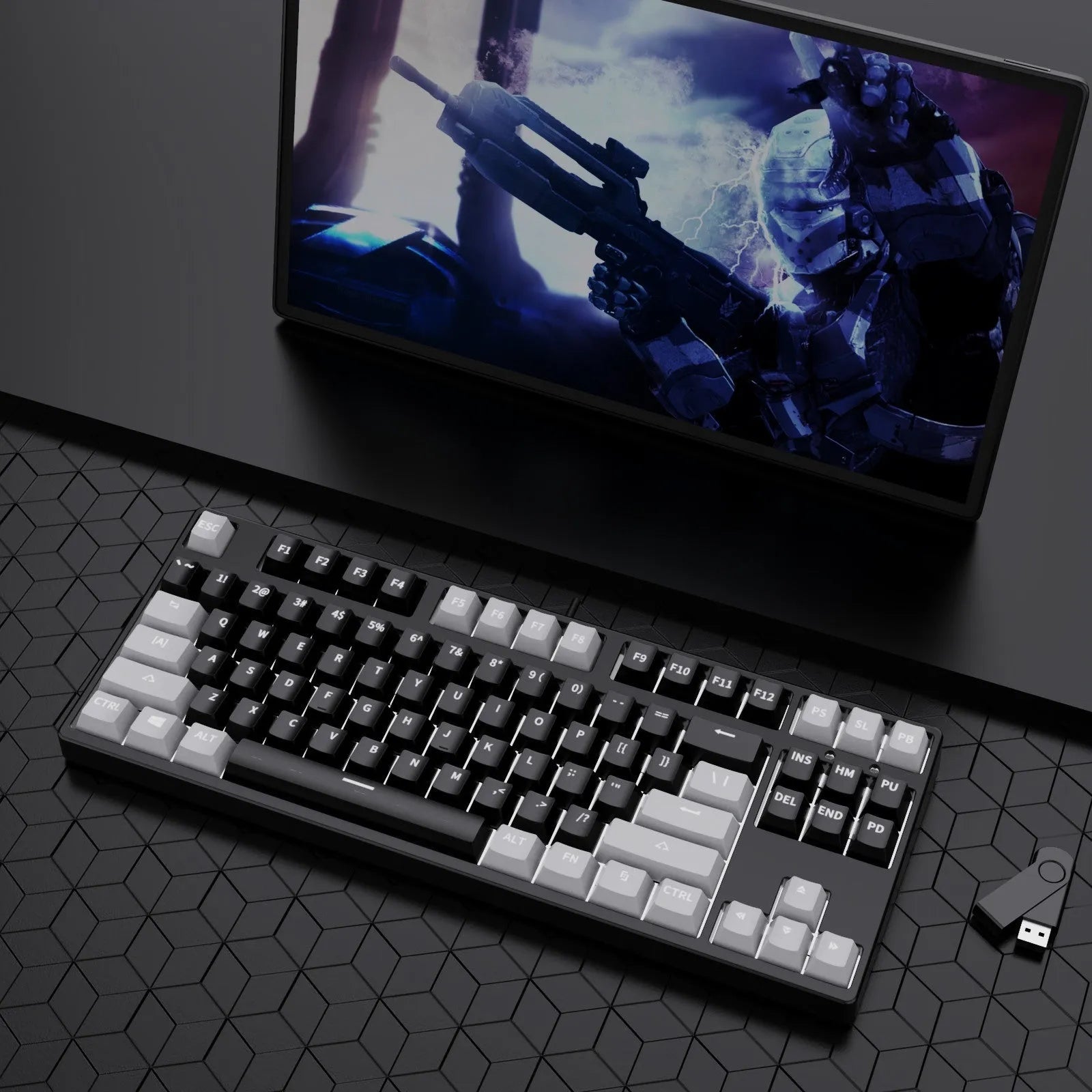 87-key wired mechanical keyboard with two-tone keycaps, shown with switch puller and cleaning brush