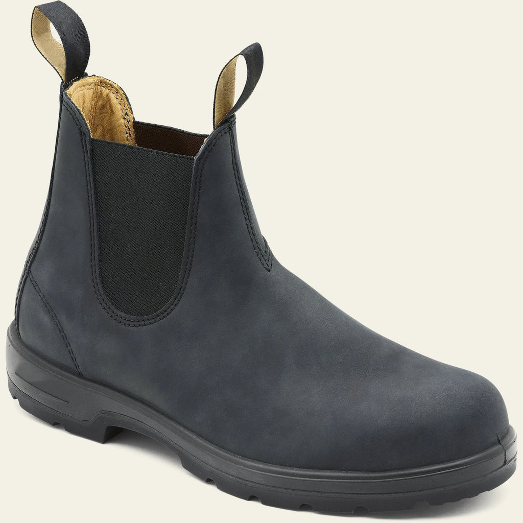 Vintage brown unisex Chelsea boot with frosted PU upper and car suture detailing on a wooden floor.