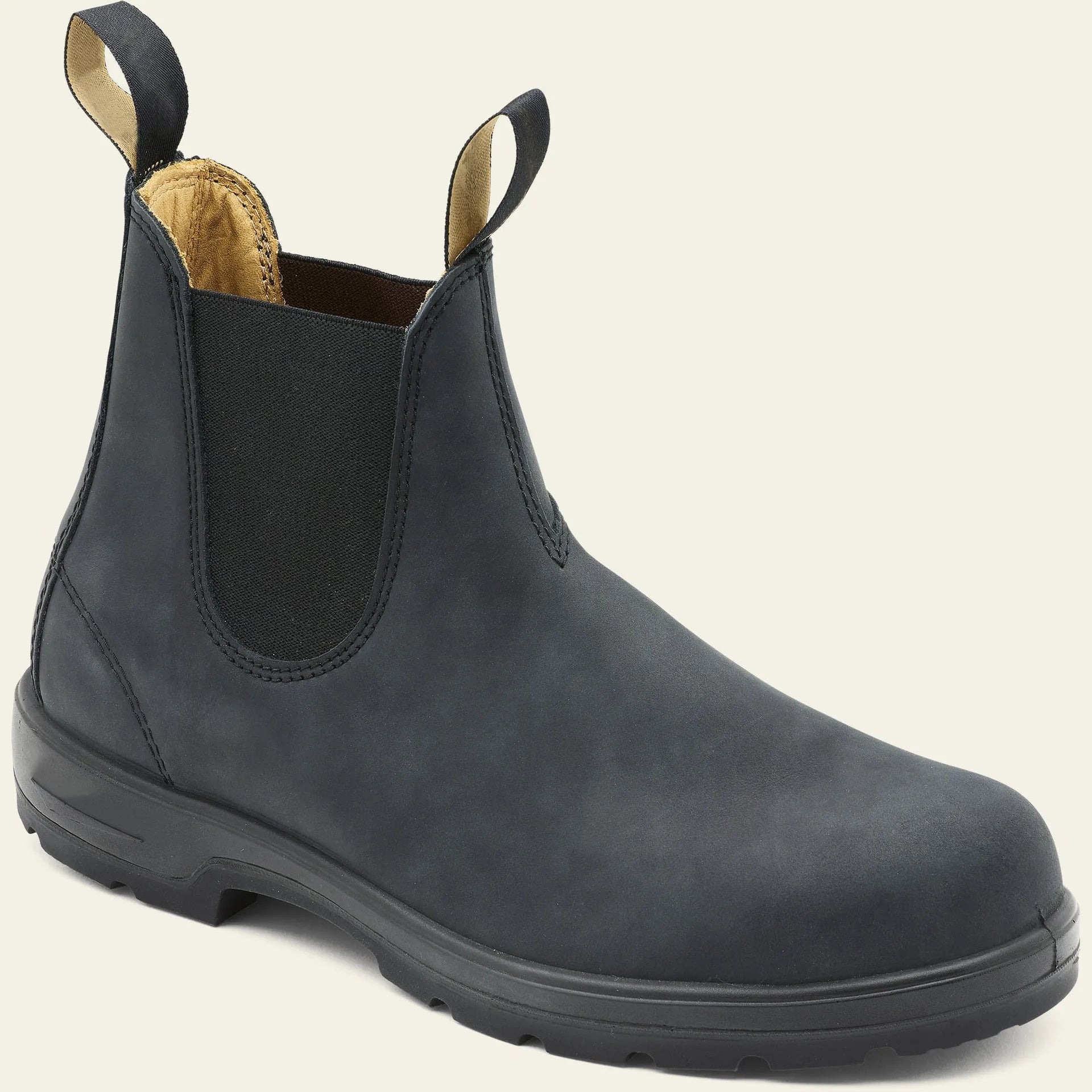 Vintage brown unisex Chelsea boot with frosted PU upper and car suture detailing on a wooden floor.