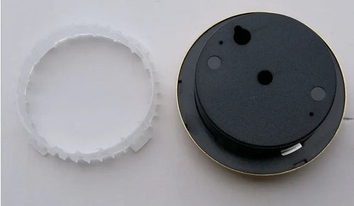 Analog thermometer and hygrometer with silver aluminium ring and dial showing temperature and humidity scales.