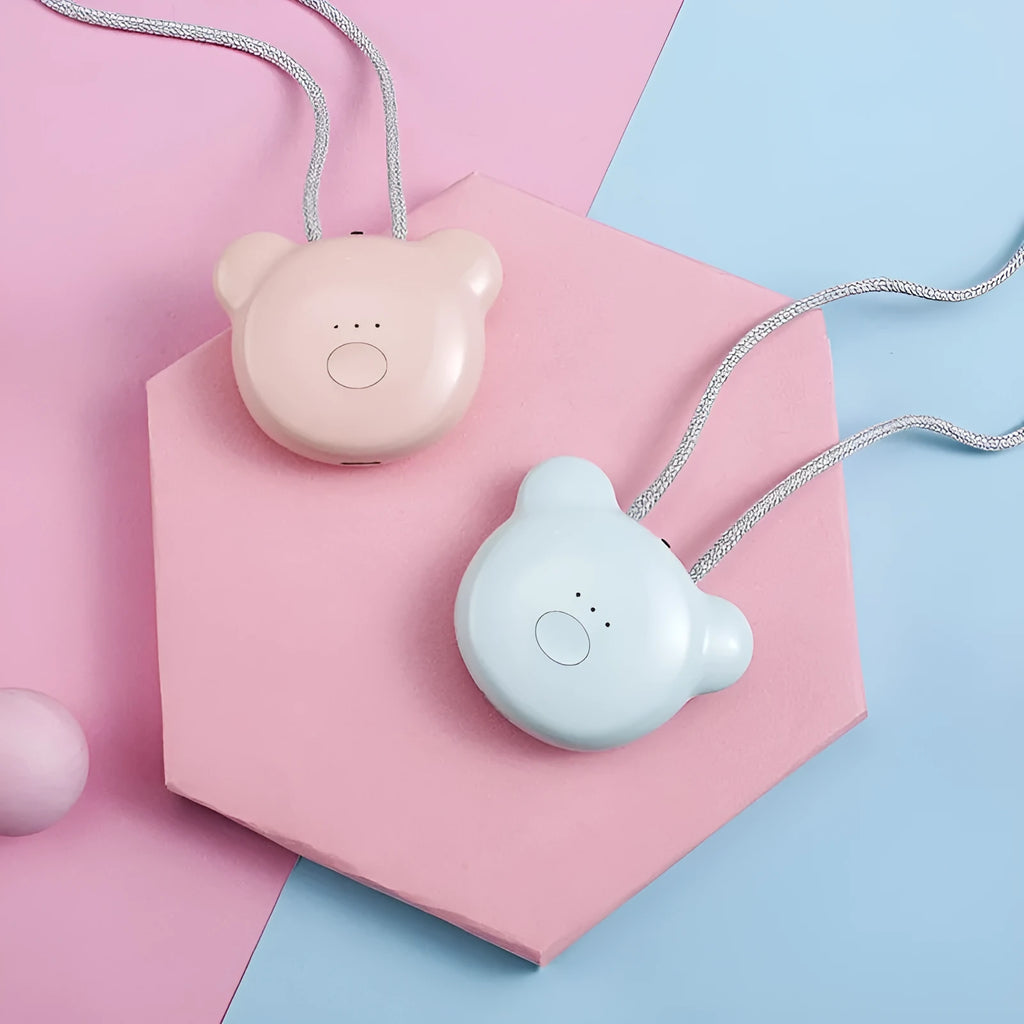 Pink portable USB air purifier necklace with charging cable showing compact wearable design