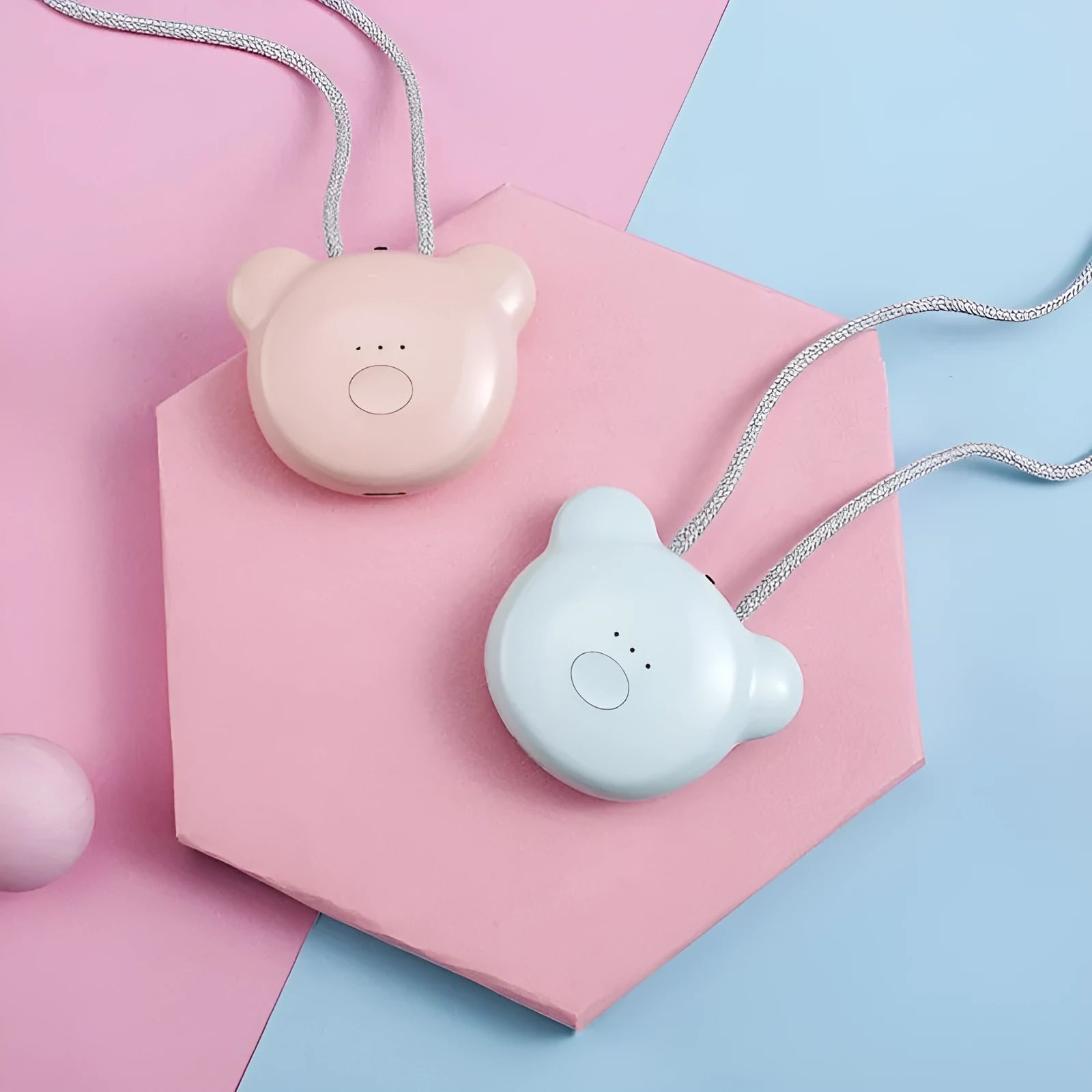 Pink portable USB air purifier necklace with charging cable showing compact wearable design