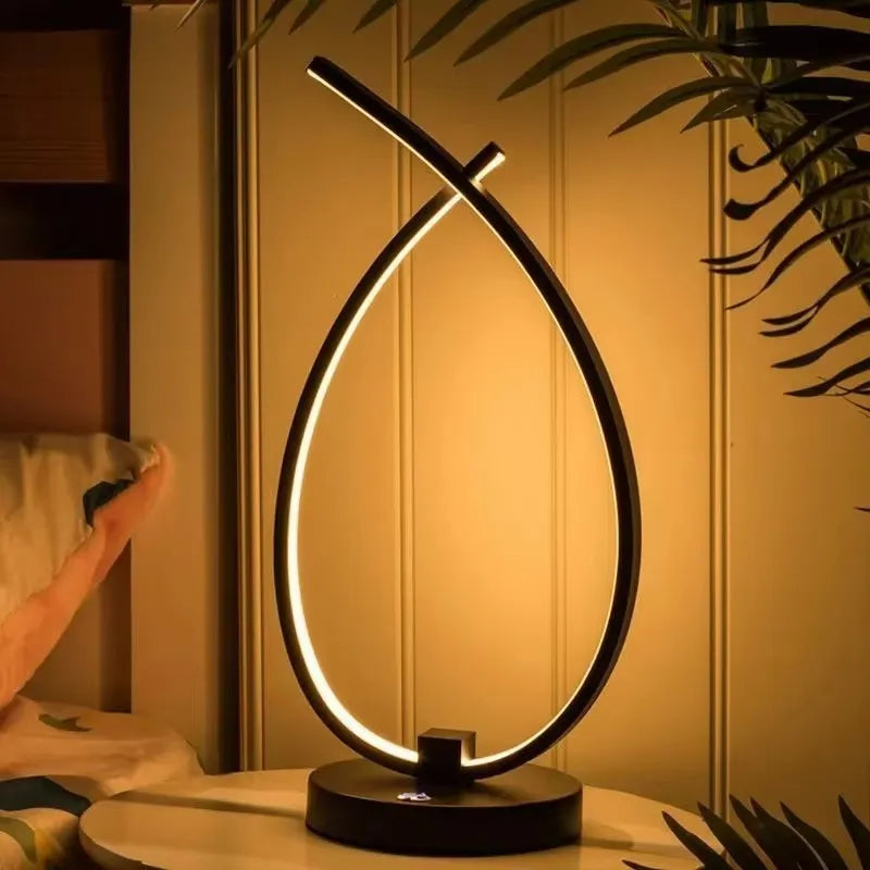 Creative water drop shaped desk lamp in black or white with warm LED lighting