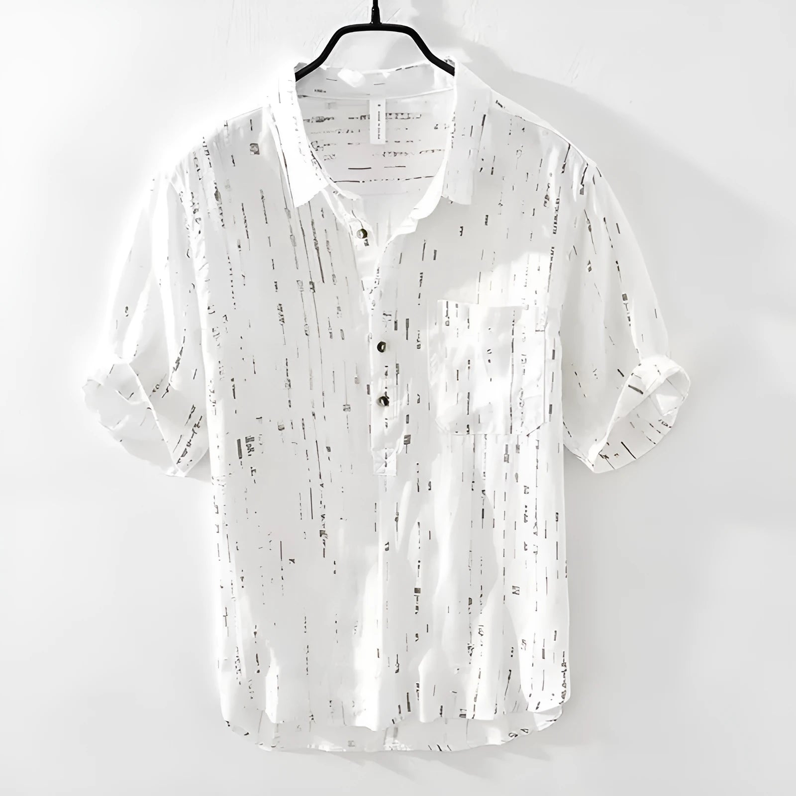 Men's loose fit black lapel polo shirt on a hanger, short sleeves, casual style.