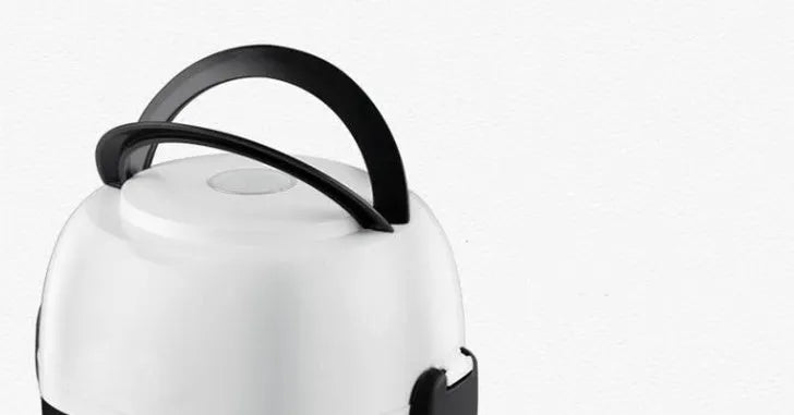 White 2L capacity rice cooker with stainless steel pot on a kitchen countertop