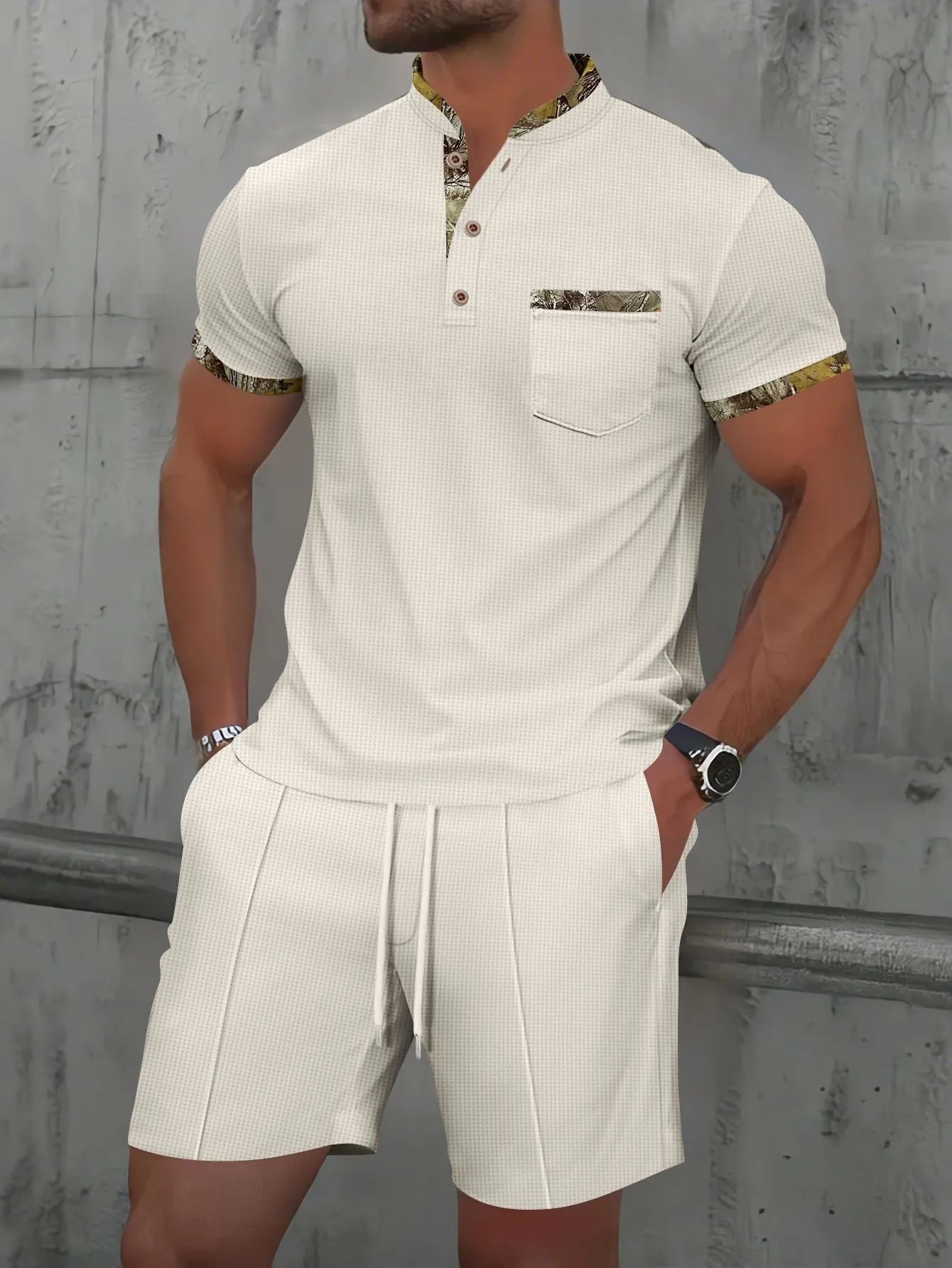 Man wearing a grey waffle knit zip-up polo collar top and matching shorts from a two-piece summer suit.