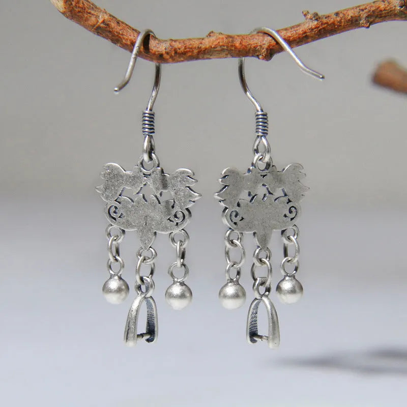 Pair of handmade 925 sterling silver koi earrings with silver colour and drop ear hook design