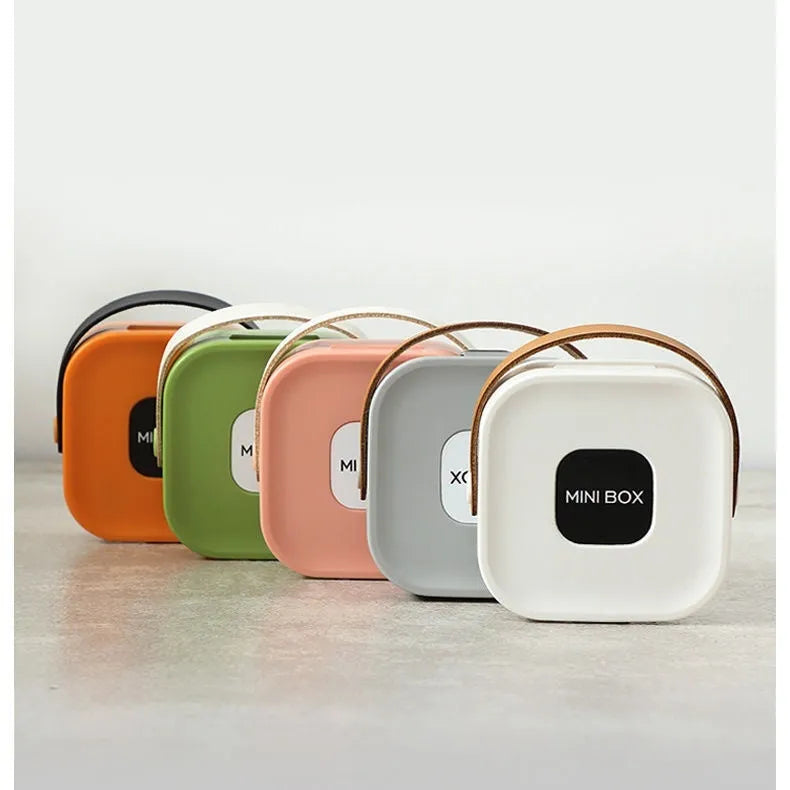 A medium-sized polypropylene storage box for organising cables, shown in Nordic White.