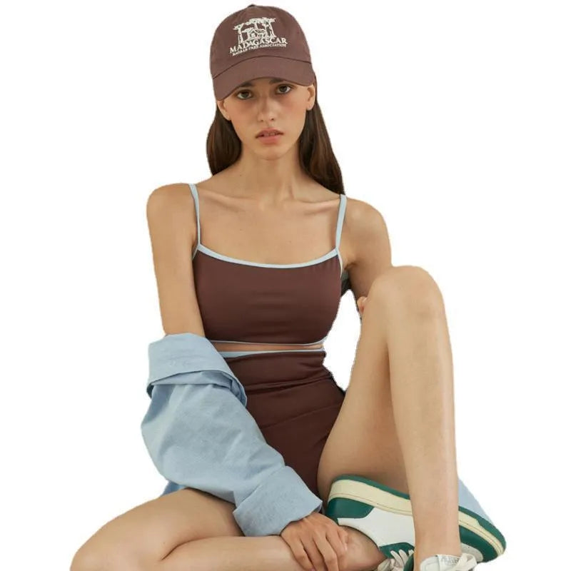 Brown women's one-piece triangle swimsuit made from nylon fabric on a mannequin.