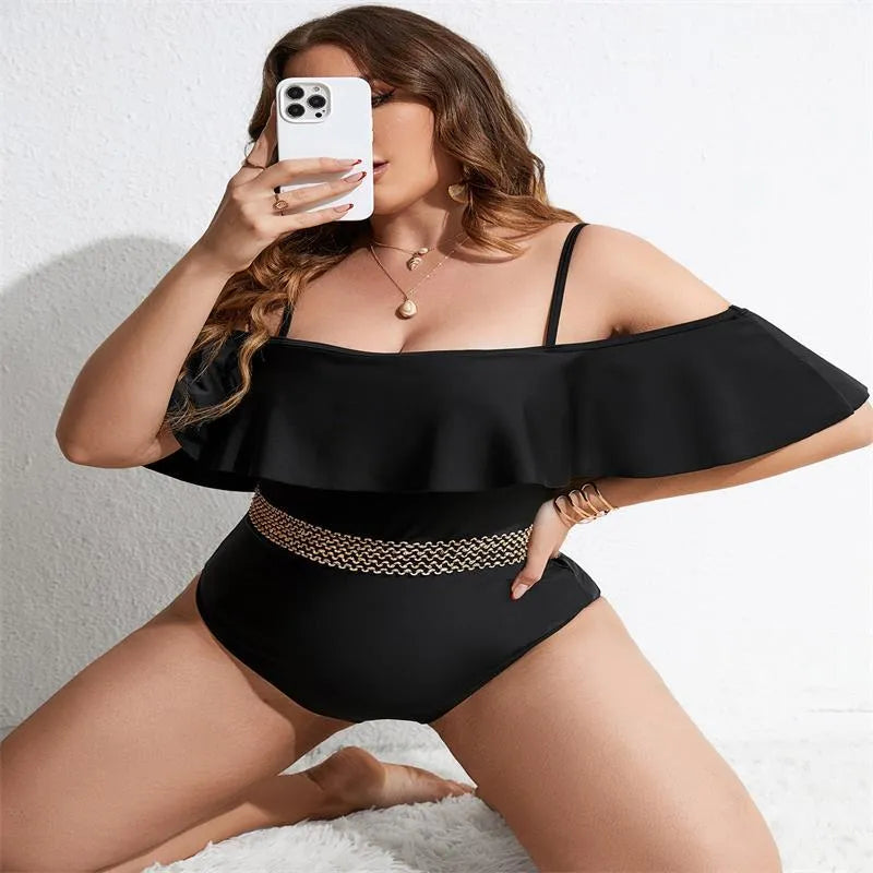Black polyester one-piece swimsuit for women on a mannequin, showing full-coverage plus-size design.