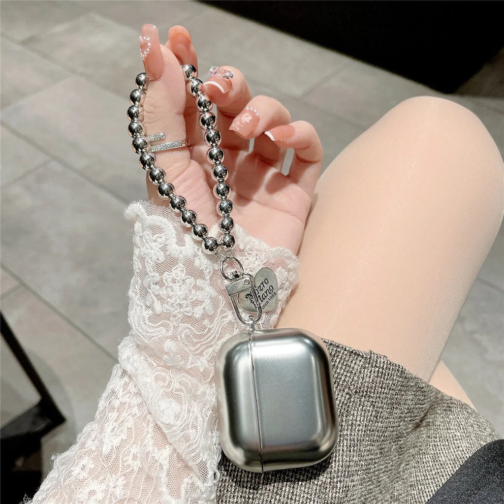 Matte plating TPU protective case for AirPods Bluetooth headsets on a plain background.