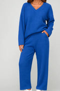 V-neck two-piece pajama set with long sleeves and pocketed trousers in solid colours, sizes S to 4XL