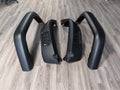 Black plastic car wheel arch set of four for universal fit on automobiles