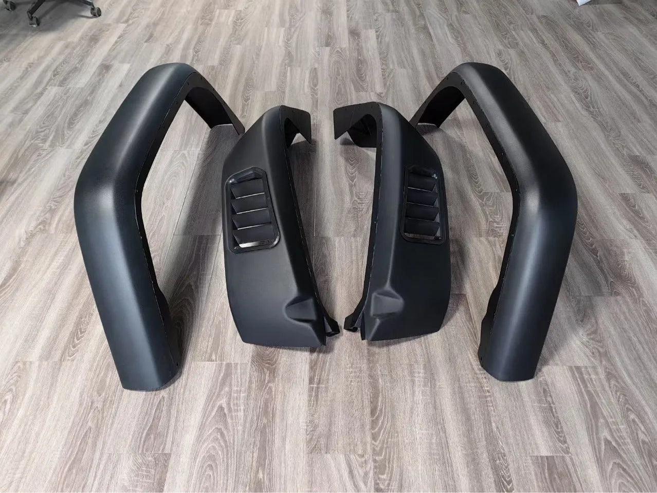 Black plastic car wheel arch set of four for universal fit on automobiles