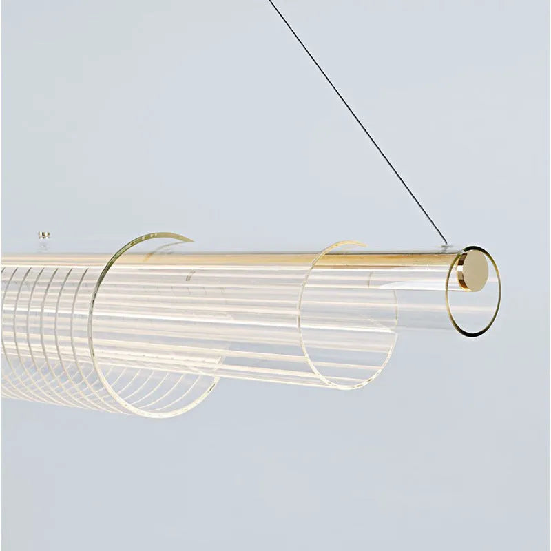 Modern clear glass pendant lamp with iron fittings hanging from a ceiling.