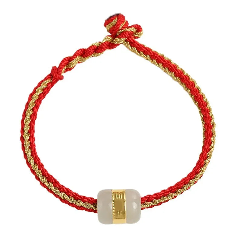 Hand-woven bracelet with Hetian jade inlay gold tone finish geometric shape on dark background