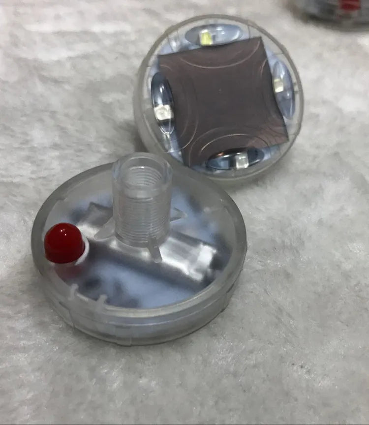 Colourful solar-powered LED valve stem cap light for car or bike wheel.