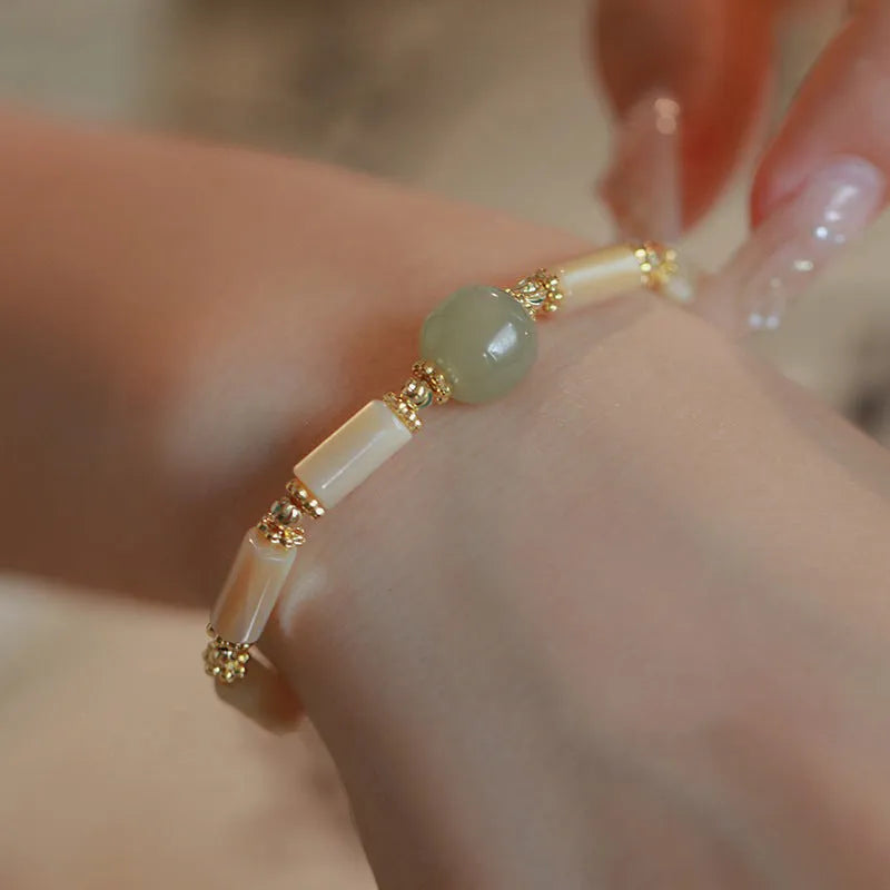 Natural Hetian jade white lip shell bracelet with geometric round beads in simple design