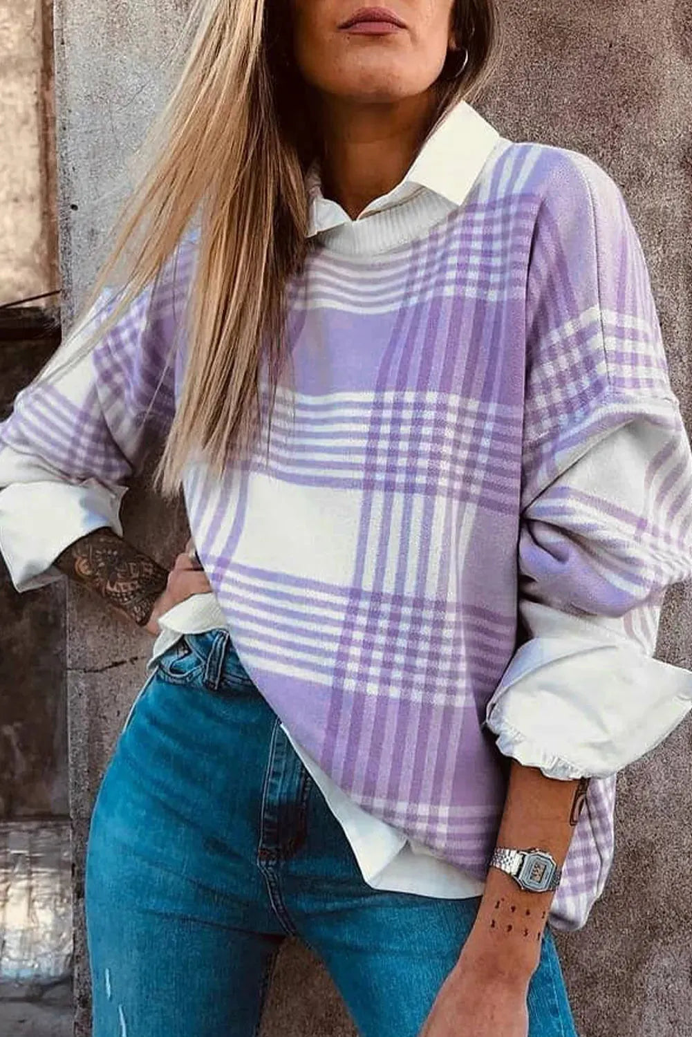 Lilac plaid print loose long-sleeve sweater with ribbed trim on mannequin.