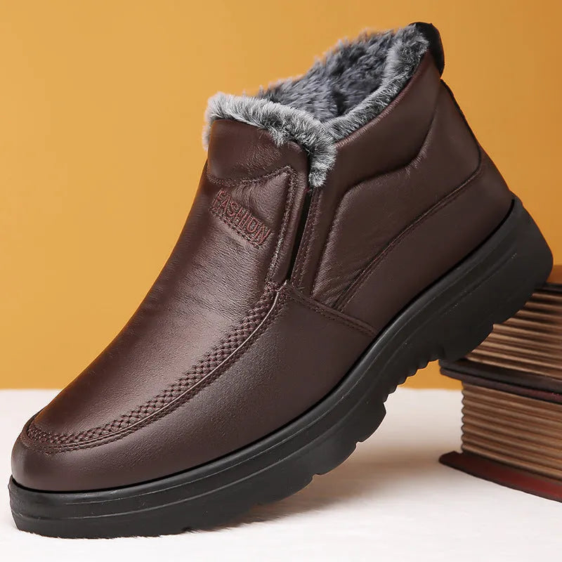 Men's black fleece-lined slip-on winter shoes with a rubber sole shown on a white background.