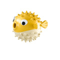 Yellow vinyl fish-shaped dog chew toy with textured surface and squeaker.