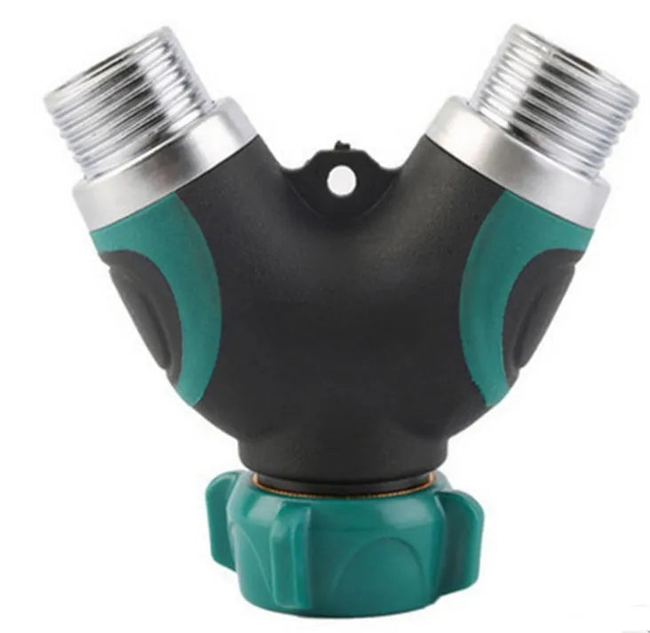 Green plastic Y type double-pass garden hose splitter with two outlets and brass-coloured inlet