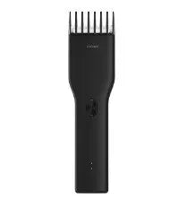 Black cordless hair clippers with ceramic cutter head and adjustable length comb for home barbering