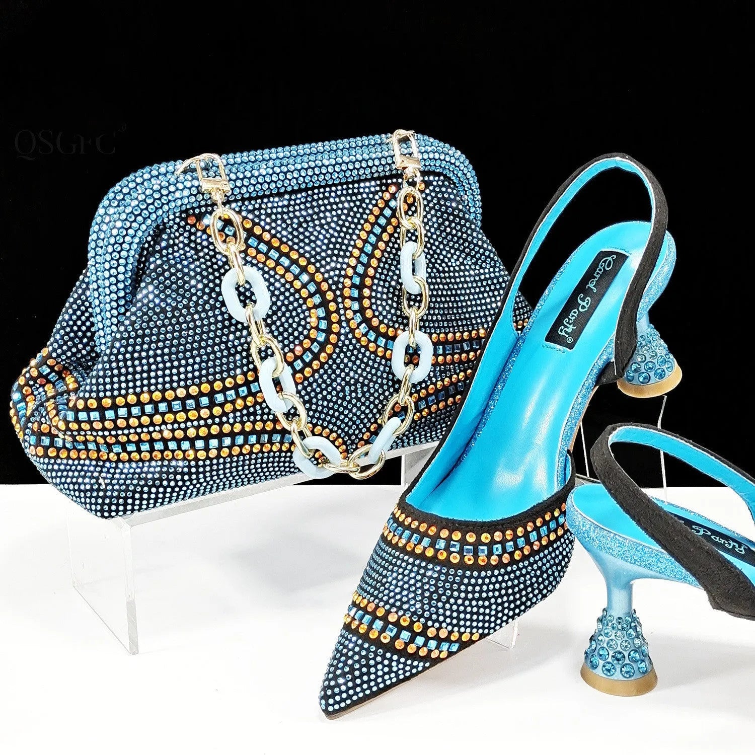 Women's pointed toe high heel shoes with matching small bag in synthetic leather, wine glass heel.