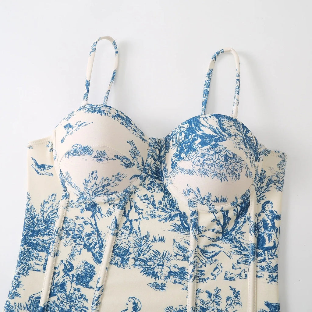 Blue women's one-piece swimsuit with matching gauze skirt set on hanger