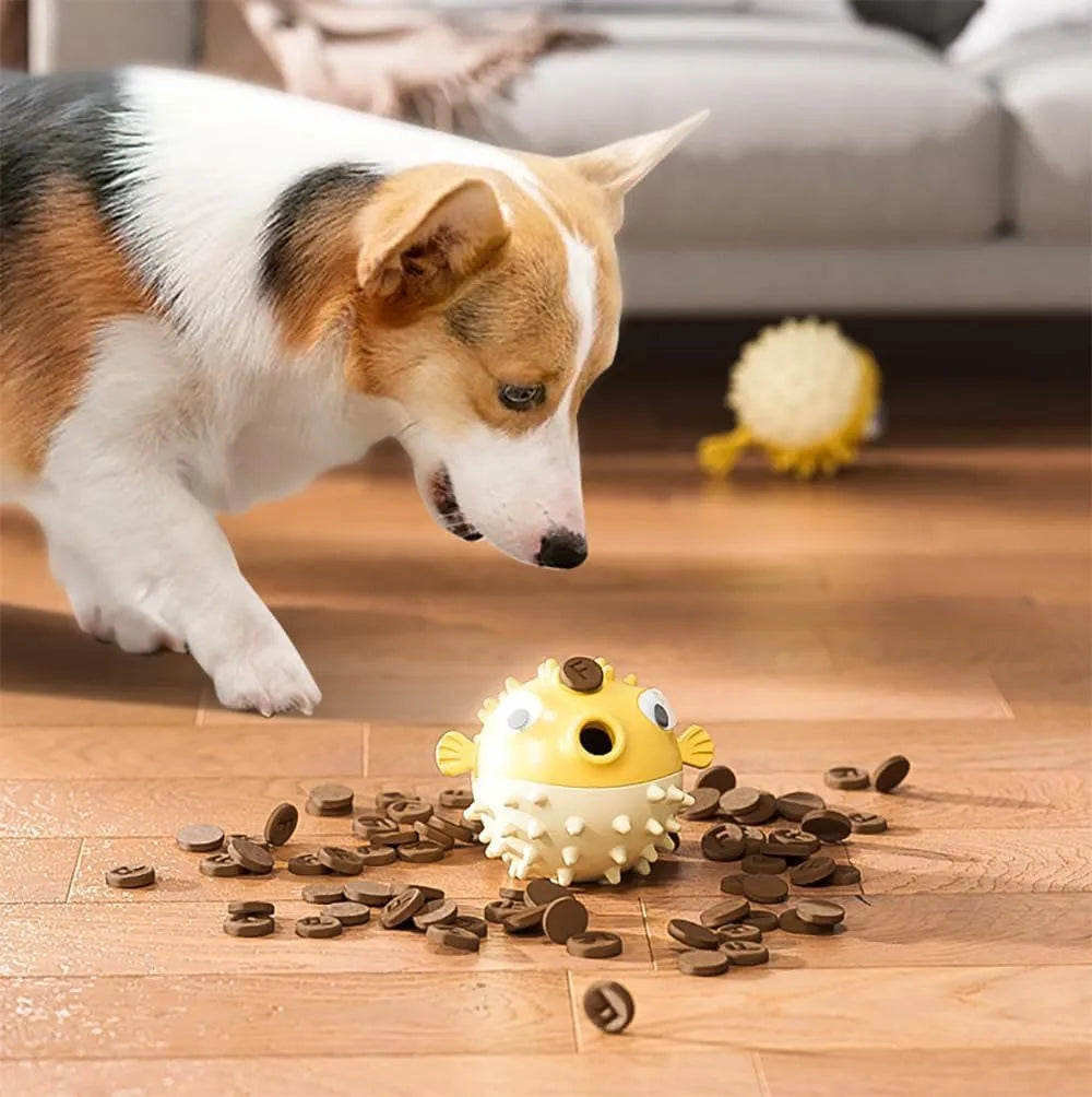 Green fish-shaped interactive dog chew toy with textured surface for treat dispensing