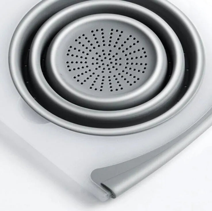 Grey multi-functional chopping board with detachable drain basket showing 50cm cutting surface