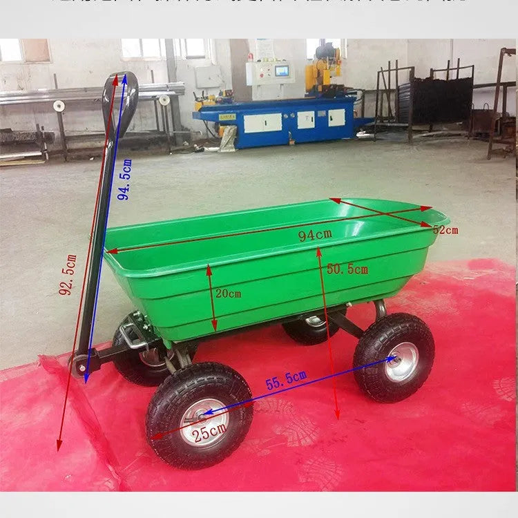 Green four-wheel plastic dump truck with a steel frame and tipping bed for garden and farm use.