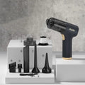 Black cordless car and home vacuum cleaner with inflation function and full accessory kit on a white background.