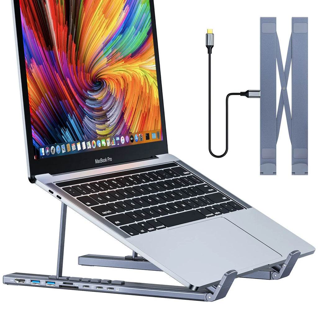 Aluminium folding laptop stand with integrated 8-in-1 docking hub ports and a short cable.