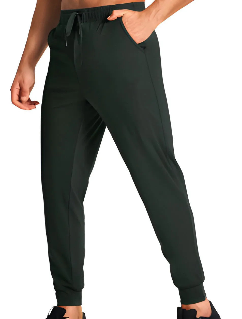Men's loose fit casual trousers in solid colour polyester fabric showing relaxed cut and casual styling