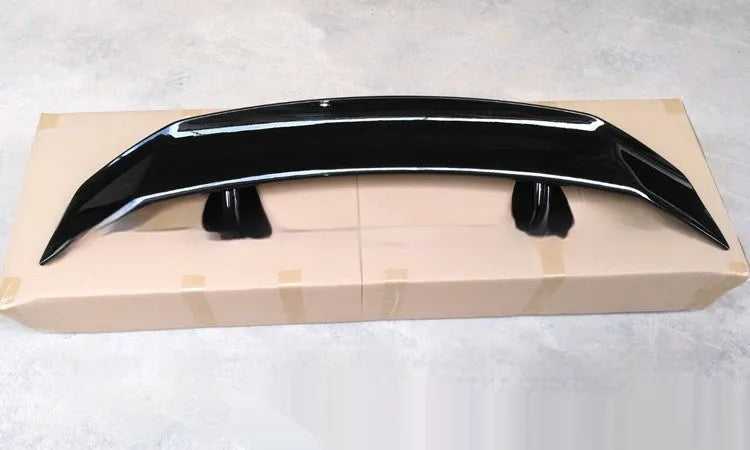 Universal punch-free car spoiler in ABS plastic shown in bright black finish.