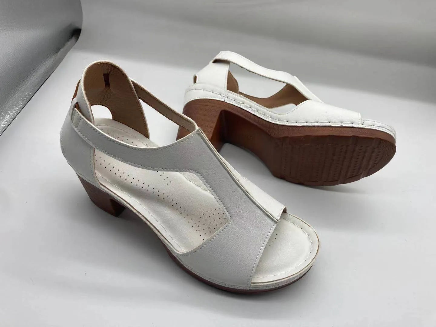 Women's peep toe wedge sandal with buckle on low heel, open fish mouth toe, in light brown