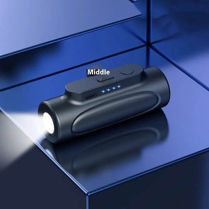 Black and pink Creative Power Bank with integrated LED flashlight, showing Apple and Type-C port options.