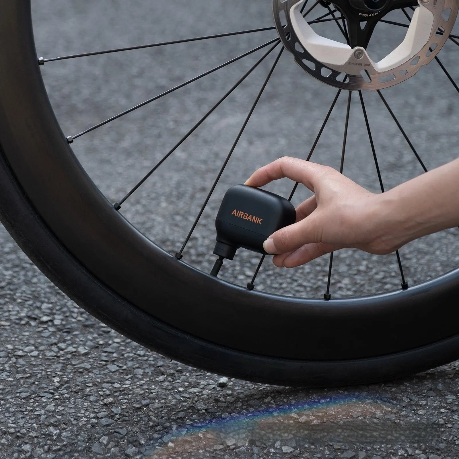 AS100 black electric bicycle pump with USB charging cable and waterproof storage bag