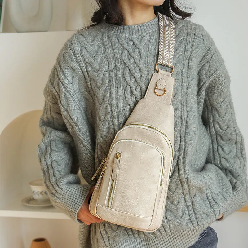 Soft brown PU leather women's crossbody messenger bag with an open front pocket and adjustable strap.