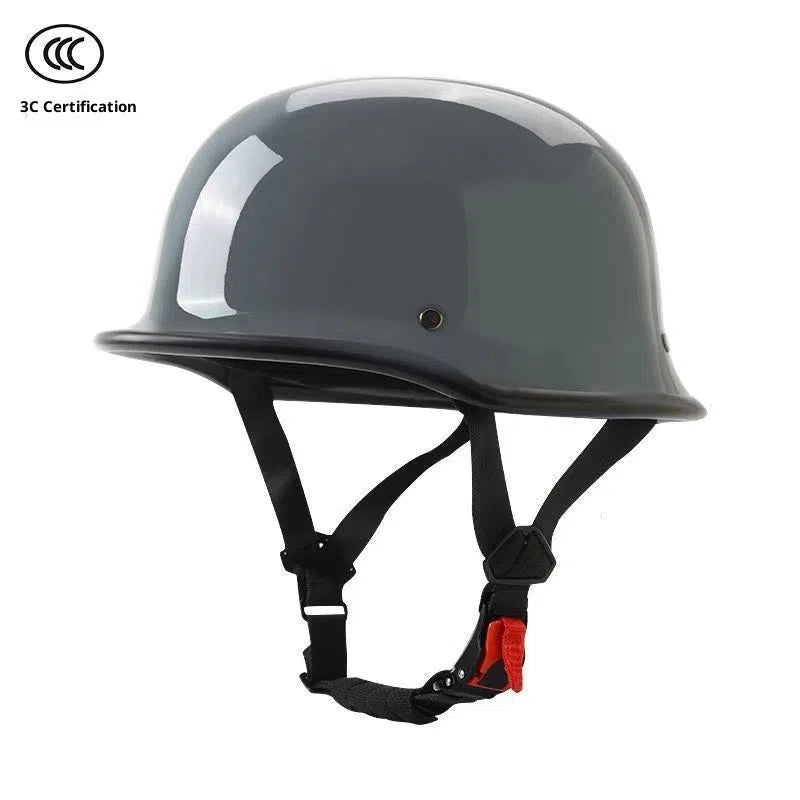 Men's retro motorcycle helmet in matte black ABS construction, side view on white background