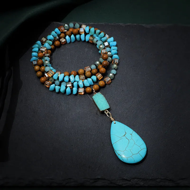 Blue turquoise imitation mineral necklace with large water drop pendant and ball bead chain.