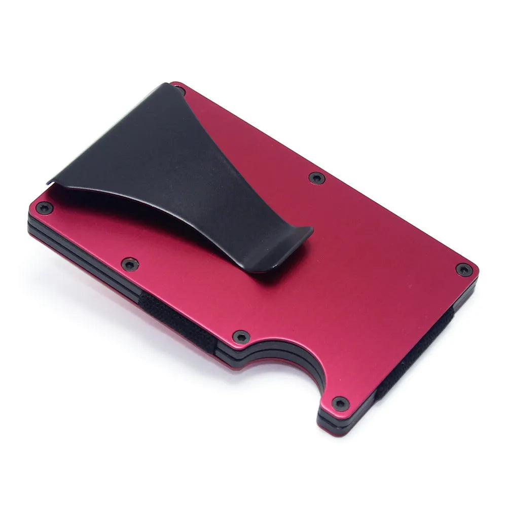 Slim black carbon fibre geometric wallet holding bank cards, showing 8mm thickness profile.