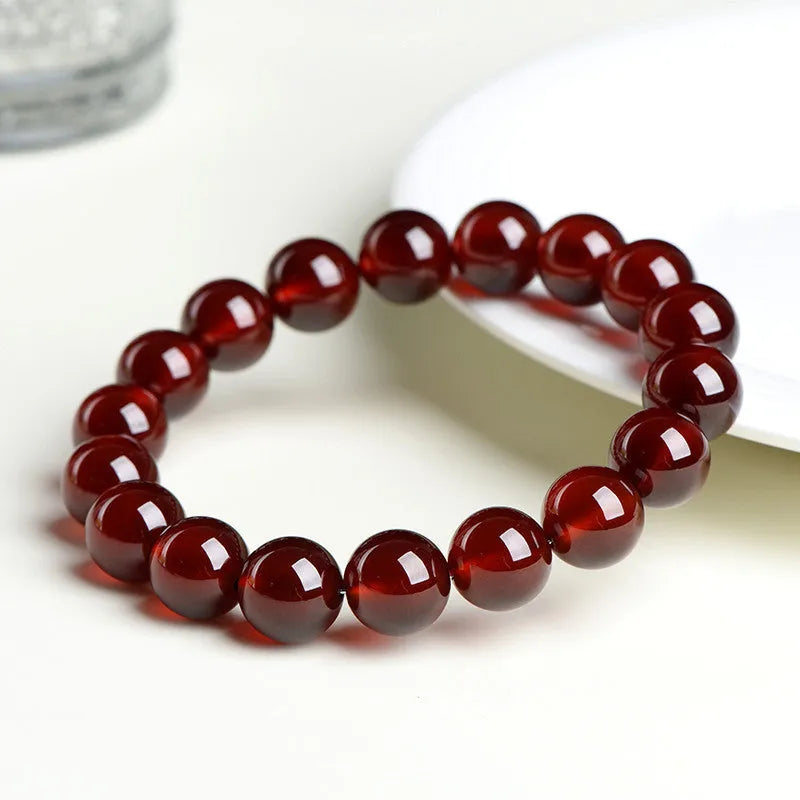 Natural orange red garnet crystal bracelet with traditional ruyi design elements in retro unisex style