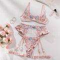 Light purple satin lingerie four-piece set with decorative embroidery on a hanger