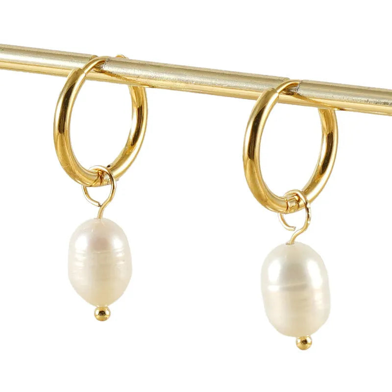 A pair of gold geometric earrings for women with pearl accents, made from stainless steel.