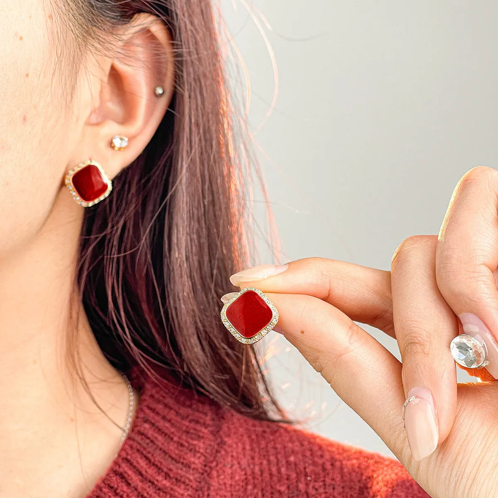 Red geometric square alloy earrings with clip-on fastening and embedded square design elements