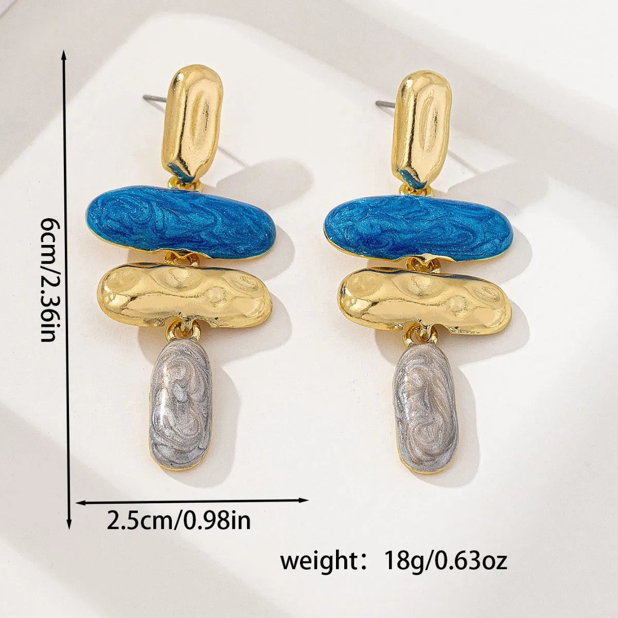 A pair of multicolour geometric stud earrings for women with a zinc alloy base and electroplated finish.