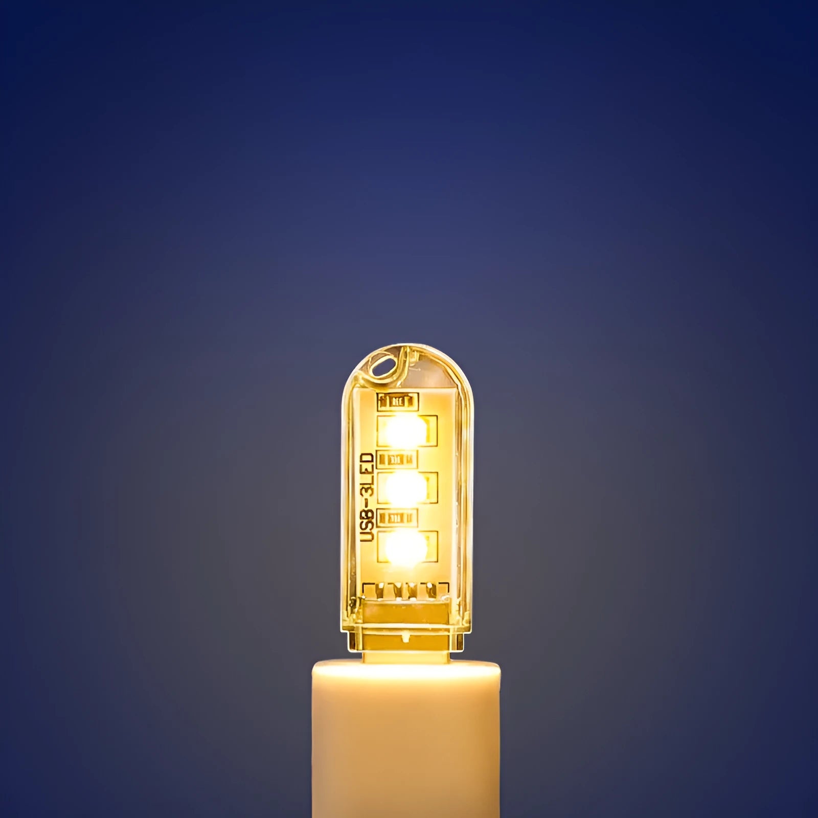 Small white USB-powered LED night light showing warm and white light options